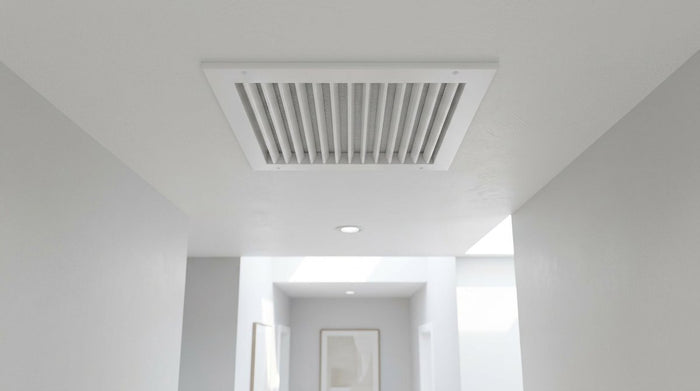 Best return air grille: white aluminum return grille in a hallway ceiling