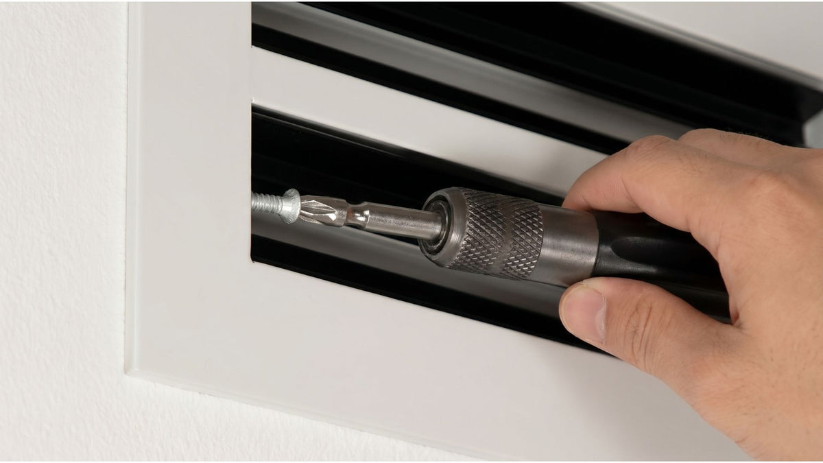 Drive the four screws — snug, not tight.